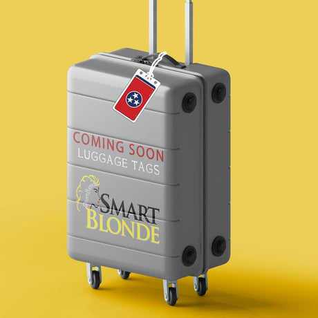 Gray suitcase with wheels, luggage tag, and 'Coming Soon Luggage Tags' text on yellow background