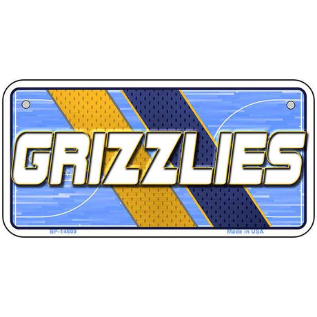 Metallic license plate with 'GRIZZLIES' text on a blue and gold background