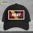 Black cap with 'HEAT' design on a gray background