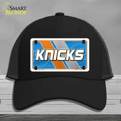 Black cap with 'Knicks' logo on a gray background