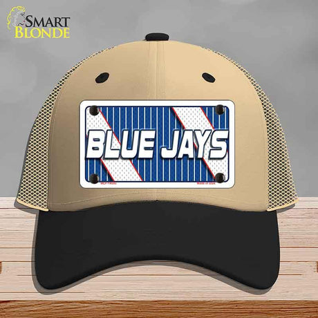 Beige and black cap with a 'Blue Jays' license plate design on a wooden surface.