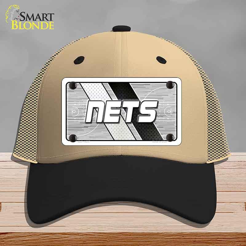 Beige and black cap with 'NETS' logo on a gray background