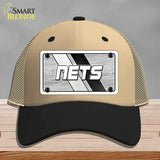 Beige and black cap with 'NETS' logo on a gray background
