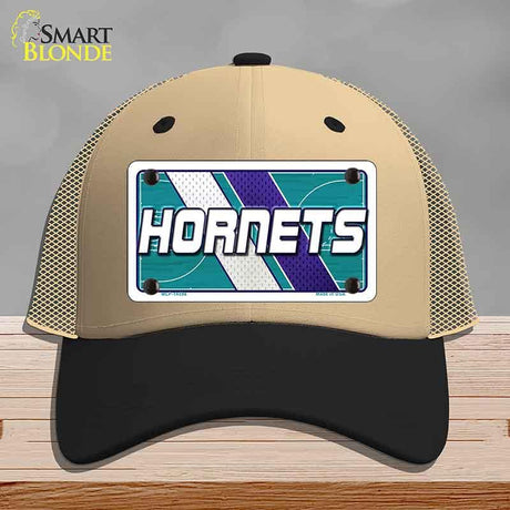 Beige and black cap with Hornets logo on a gray background