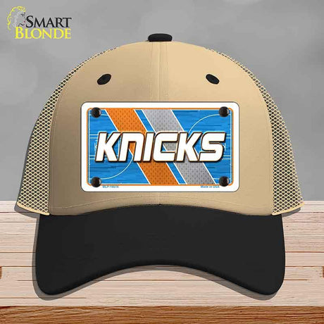 Beige and black cap with 'Knicks' design on a gray background