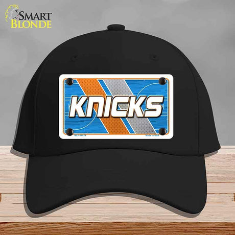Black cap with 'Knicks' logo on a gray background