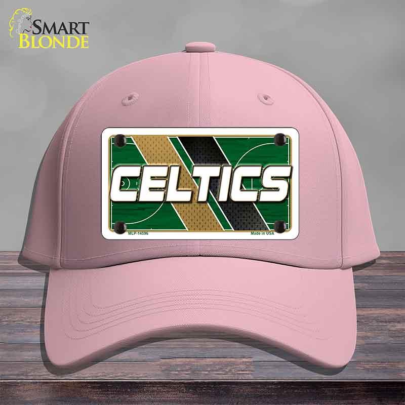 Pink cap with Celtics logo on a wooden surface
