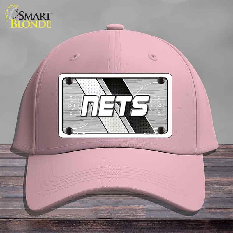 Pink cap with 'NETS' logo on a gray background