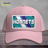 Pink cap with Hornets logo on a gray background
