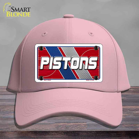 Pink cap with a 'Pistons' logo on a gray background