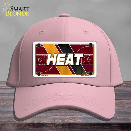 Pink cap with 'HEAT' design on a gray background