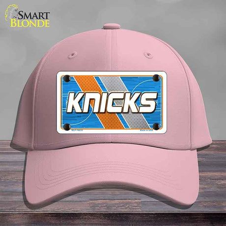 Pink cap with a 'Knicks' license plate design on a gray background