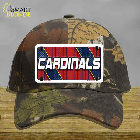 Camouflage cap with a 'Cardinals' logo on a wooden surface