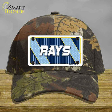 Camouflage cap with a 'RAYS' license plate on a wooden surface