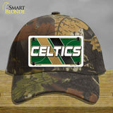 Camouflage cap with Celtics logo on a wooden surface