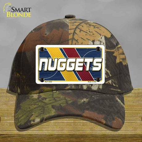 Camouflage cap with a 'NUGGETS' license plate design on a wooden surface.