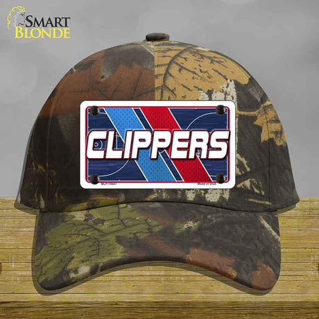 Camouflage cap with a 'CLIPPERS' logo on a wooden surface