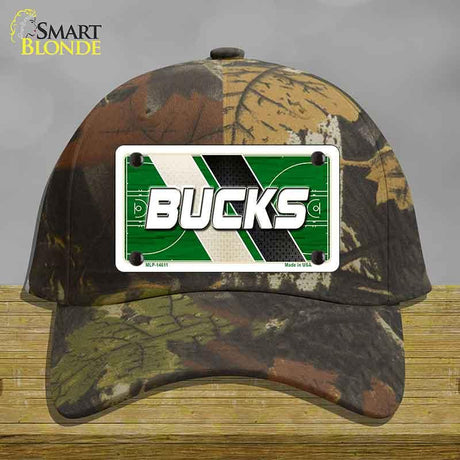 Camouflage cap with a 'Bucks' license plate on a wooden surface