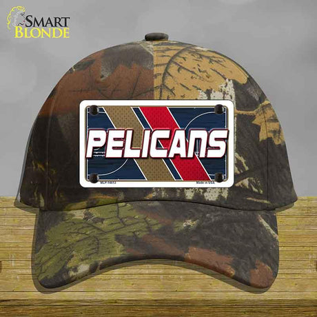 Camouflage cap with a 'Pelicans' license plate design on a wooden surface.