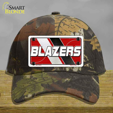 Camouflage cap with a 'BLAZERS' license plate design on a wooden surface.