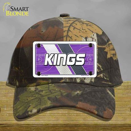 Camouflage cap with a 'KINGS' logo on a gray background