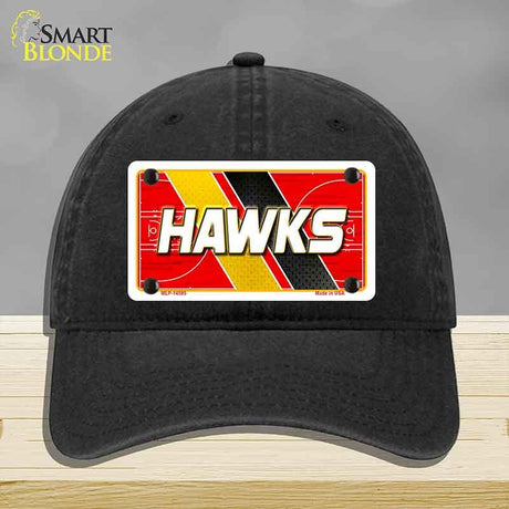 Black cap with a red and yellow 'HAWKS' license plate design on a gray background
