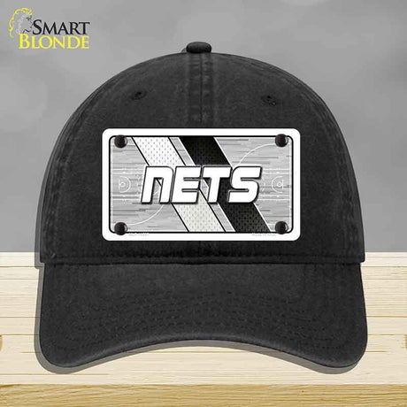 Black cap with 'NETS' logo on a gray background