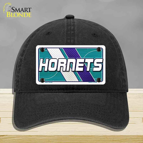 Black cap with Hornets logo on a gray background