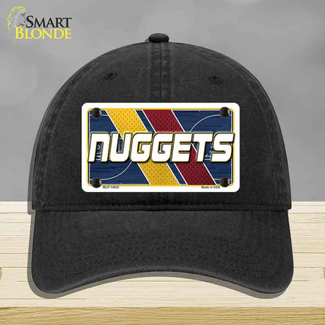 Black cap with a colorful 'NUGGETS' license plate design on a gray background