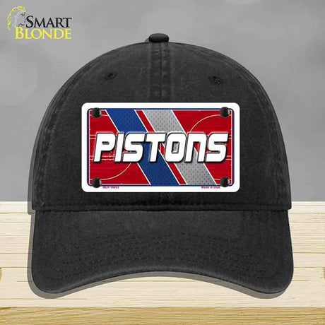 Black cap with 'PISTONS' logo on a gray background