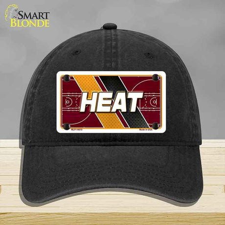Black cap with 'HEAT' design on a gray background
