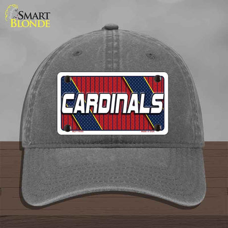 Gray cap with 'Cardinals' logo on a wooden surface