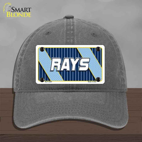 Gray cap with a 'RAYS' license plate design on a wooden surface