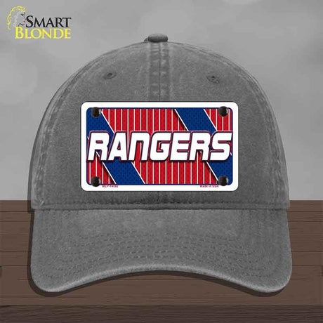 Gray cap with a 'Rangers' logo on a wooden surface