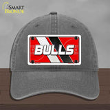 Gray cap with a 'BULLS' license plate design on a wooden surface