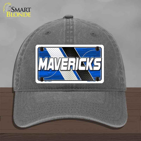 Gray cap with a 'MAVERICKS' license plate design on a wooden surface.