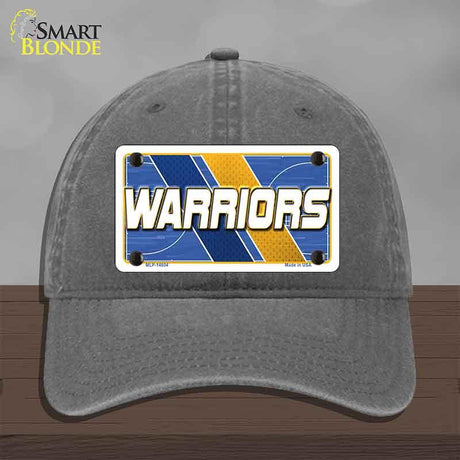 Gray cap with 'Warriors' license plate design on a wooden surface
