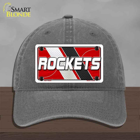 Gray cap with 'ROCKETS' license plate design on a wooden surface