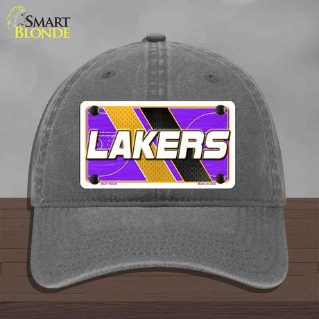 Gray cap with a Lakers license plate design on a wooden surface