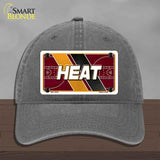 Gray cap with 'HEAT' license plate design on a wooden surface