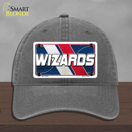 Gray cap with 'Wizards' license plate design on a wooden surface