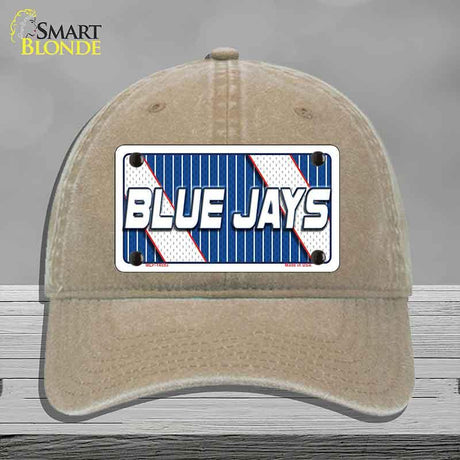 Beige cap with a 'Blue Jays' license plate design on a gray background
