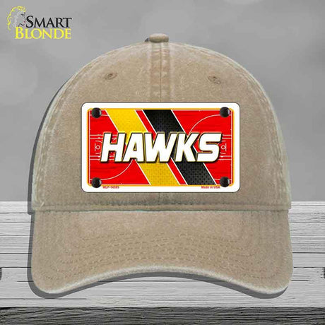 Beige cap with a 'HAWKS' license plate design on a gray background