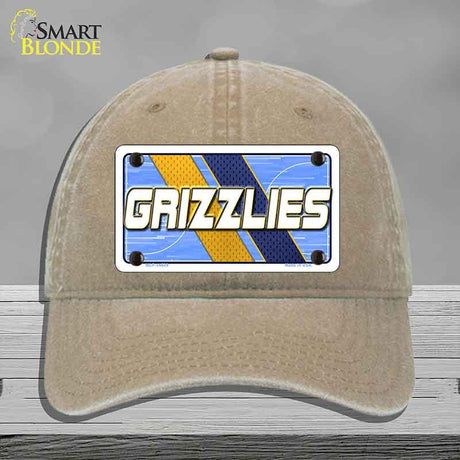 Beige cap with a 'GRIZZLIES' license plate design on a gray background