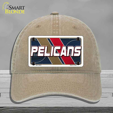 Beige cap with a 'Pelicans' logo on a gray background