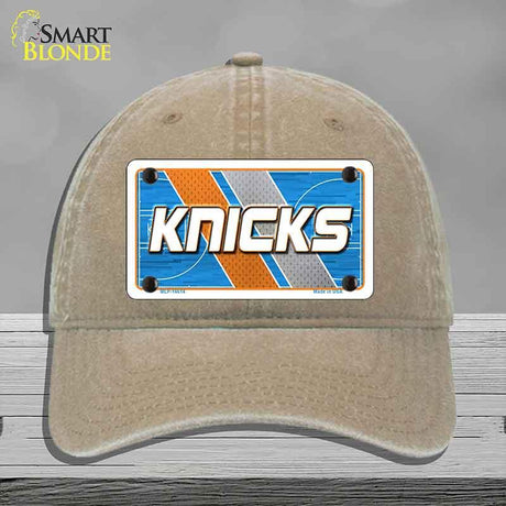 Beige cap with a 'Knicks' license plate design on a gray background