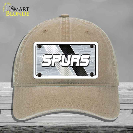 Beige cap with a 'SPURS' license plate design on a gray background