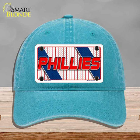 Blue cap with Phillies logo on a gray background
