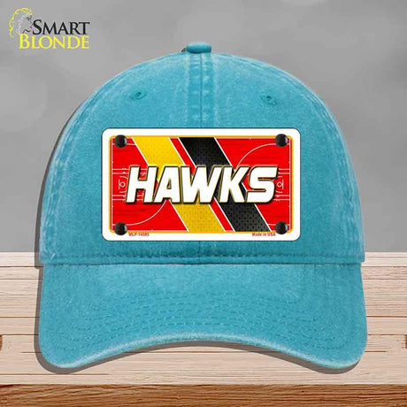 Blue cap with a 'HAWKS' license plate design on a gray background