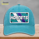 Blue cap with 'Hornets' logo on a gray background